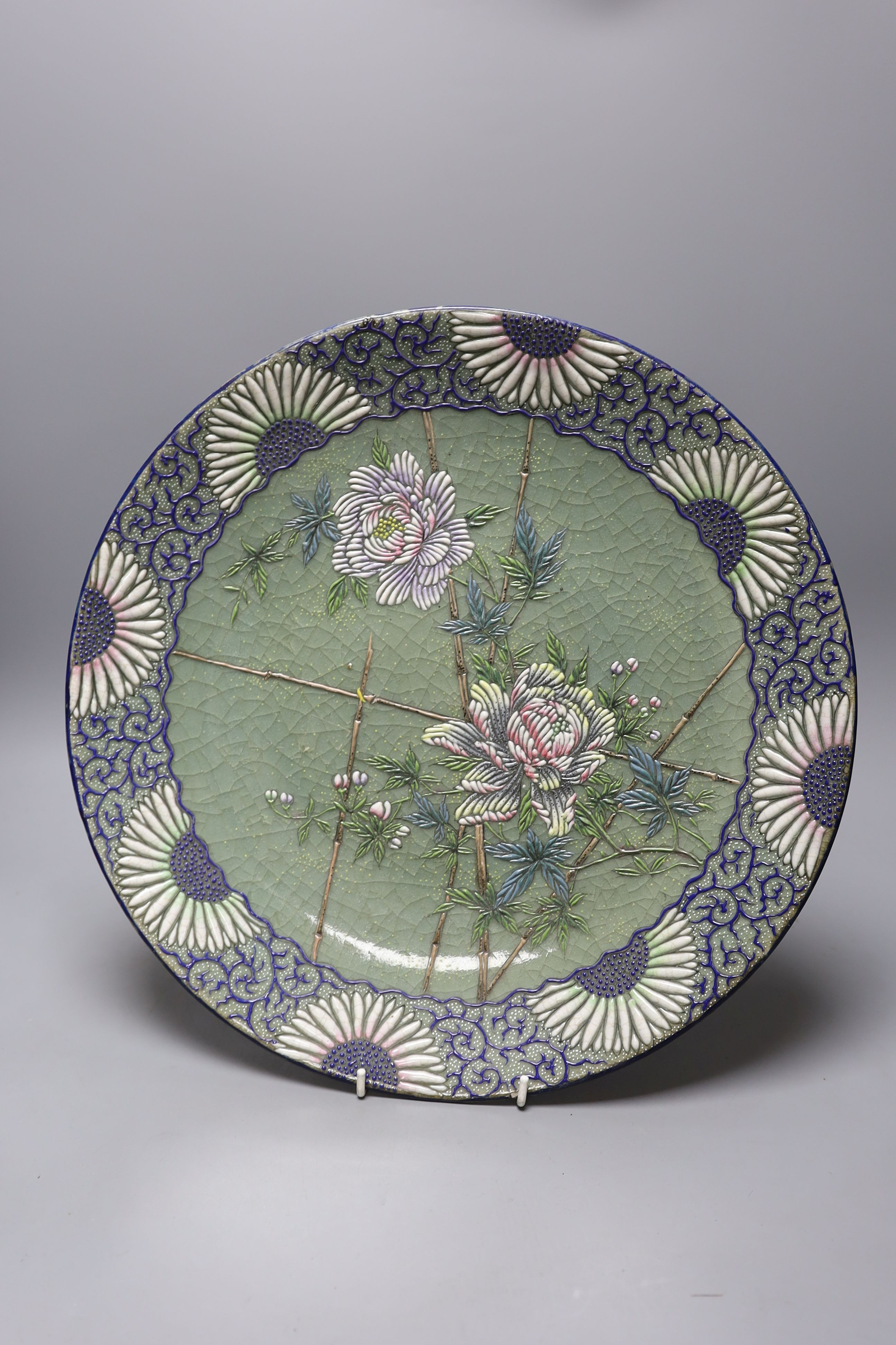 A pair of Japanese pottery moriage celadon ground dishes, early 20th century, 38cm